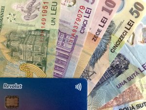 The revolution card accompanied by Romanian banknotes
